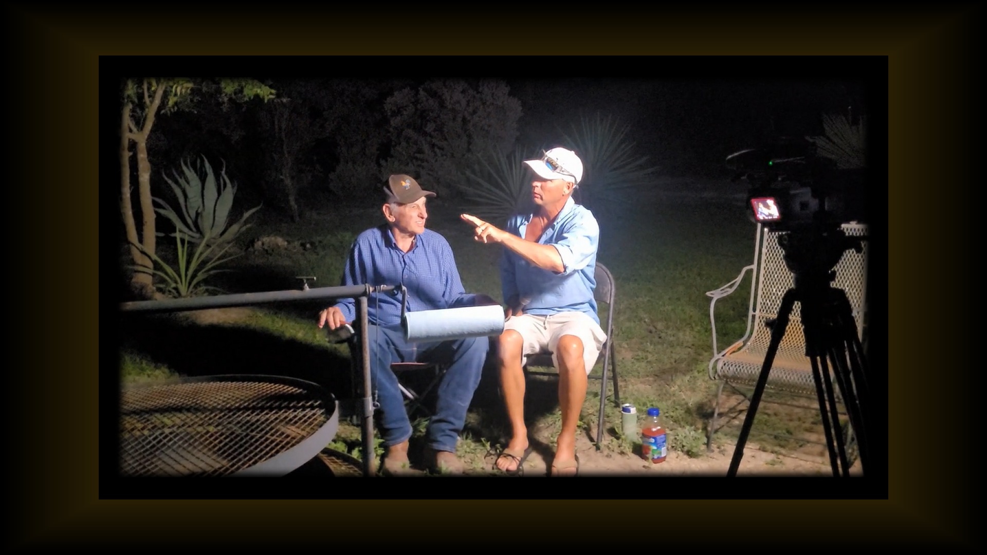 Leroy Rankin and Gary Rankin sharing stories beside the fire
